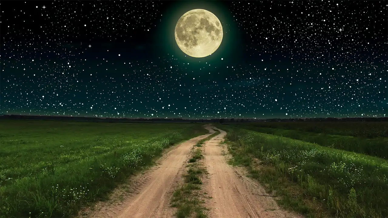 Full moon illuminating a dirt road